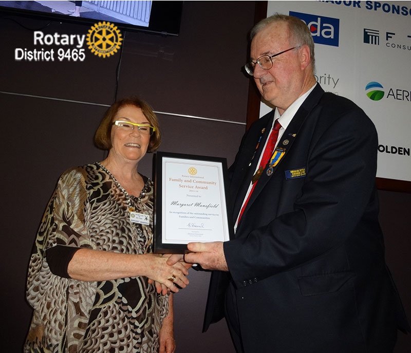 DG 2013-14 Erwin Biemel Presents Margaret Mansfield of Mill Point Rotary with the Family & Community Service Award